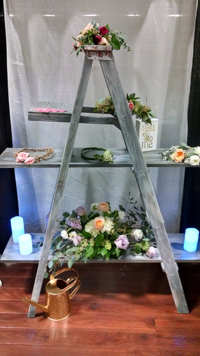5' Rustic Ladder with or without shelves. Great for adding some county charm to your event. Has a grey barn wood look. Wonderful for a floral or theme display, or a unique name card table. Contact us to reserve this item 